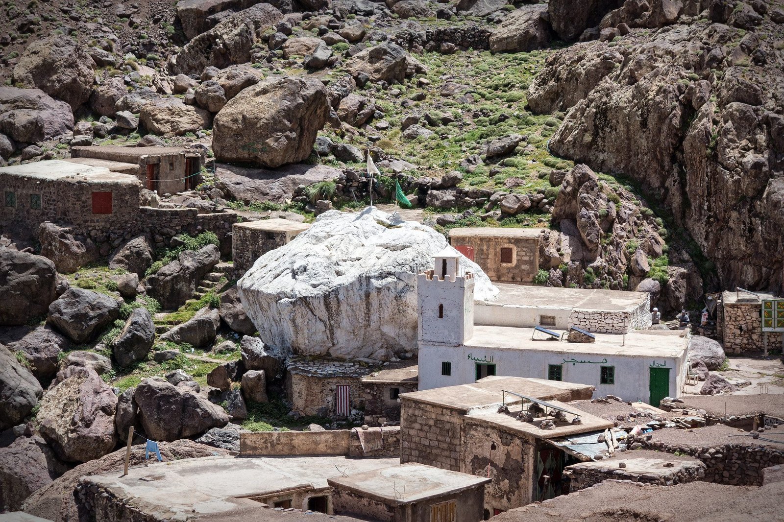 The Sidi Chamharouch shrine, a white-painted boulder among the houses
