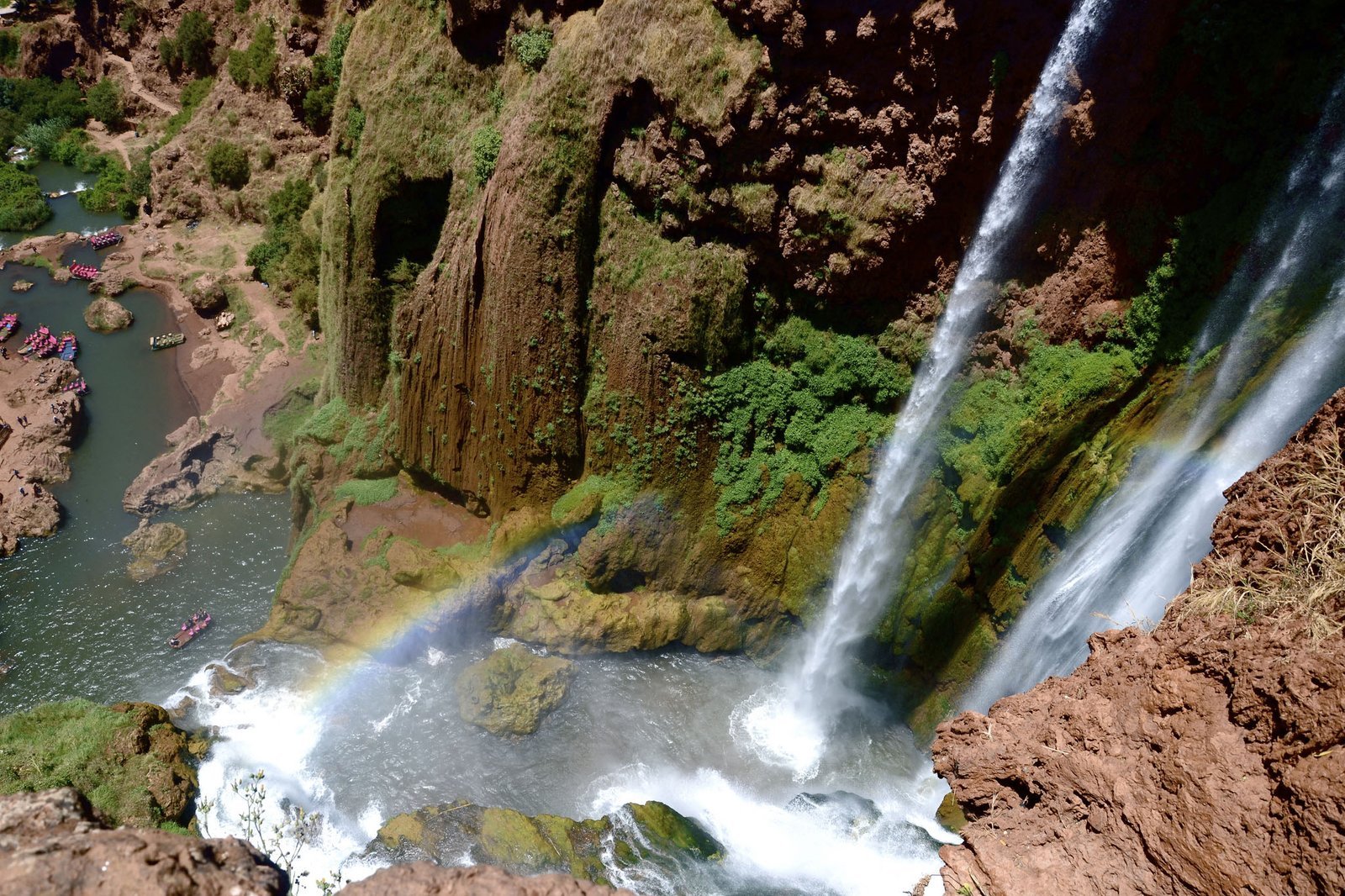 Looking down on the Ouzoud falls with a rainbow in the spray