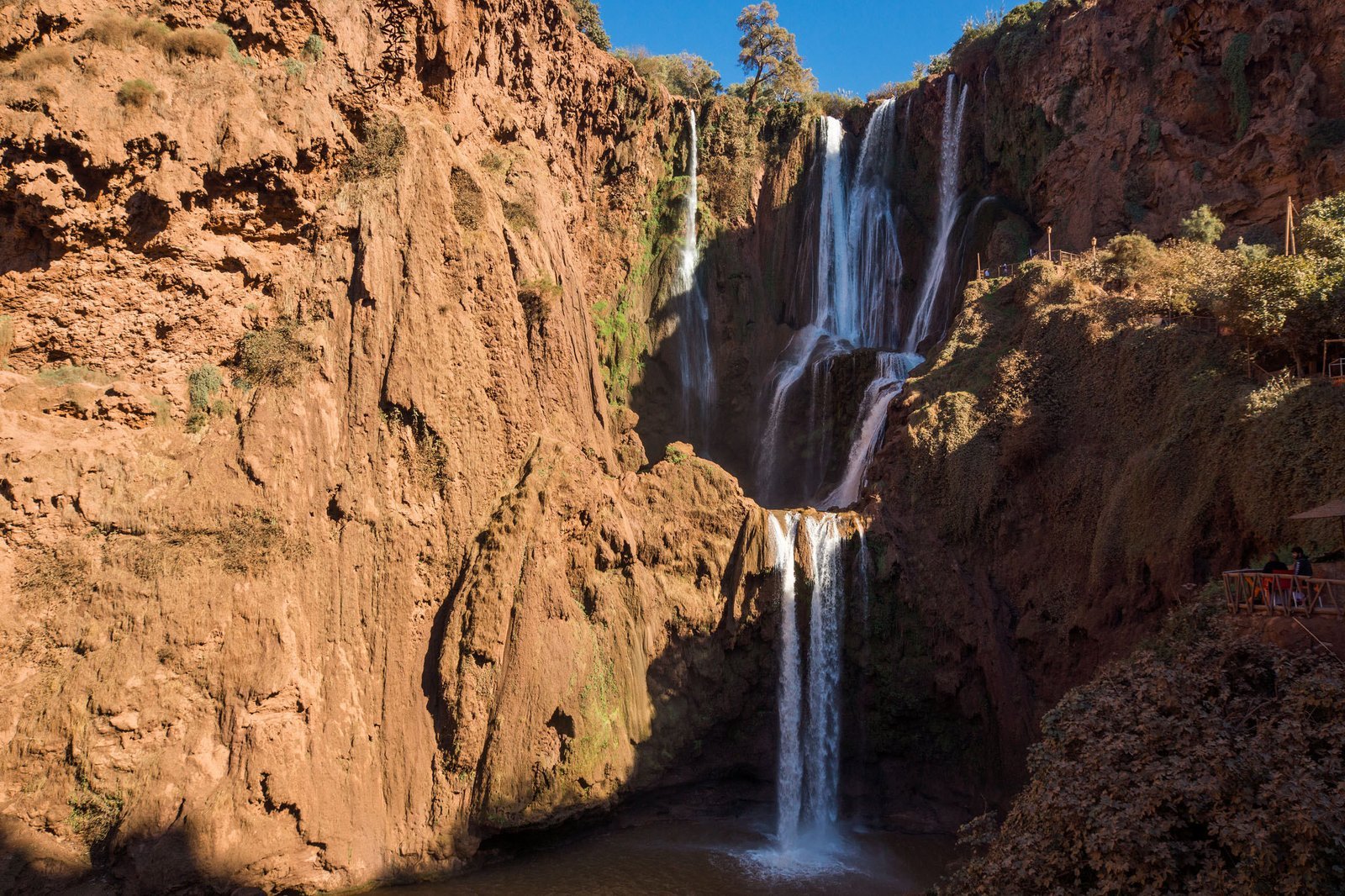 Ouzoud falls pouring down red cliffs